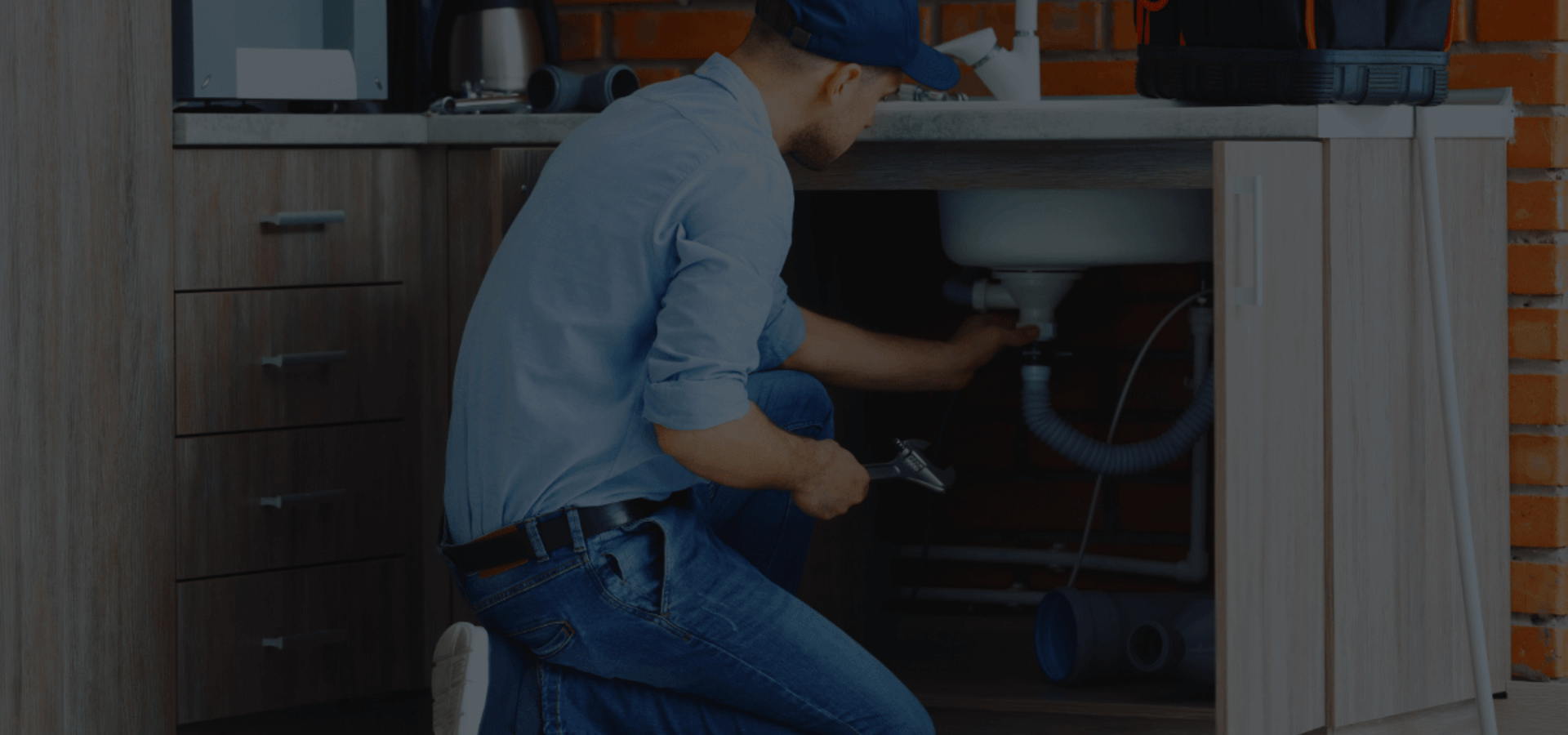 Affordable plumber repairing faucet in modern kitchen – Home Fixing Master