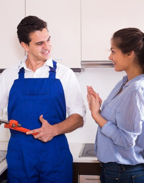 Licensed plumber answering customer questions about plumbing services